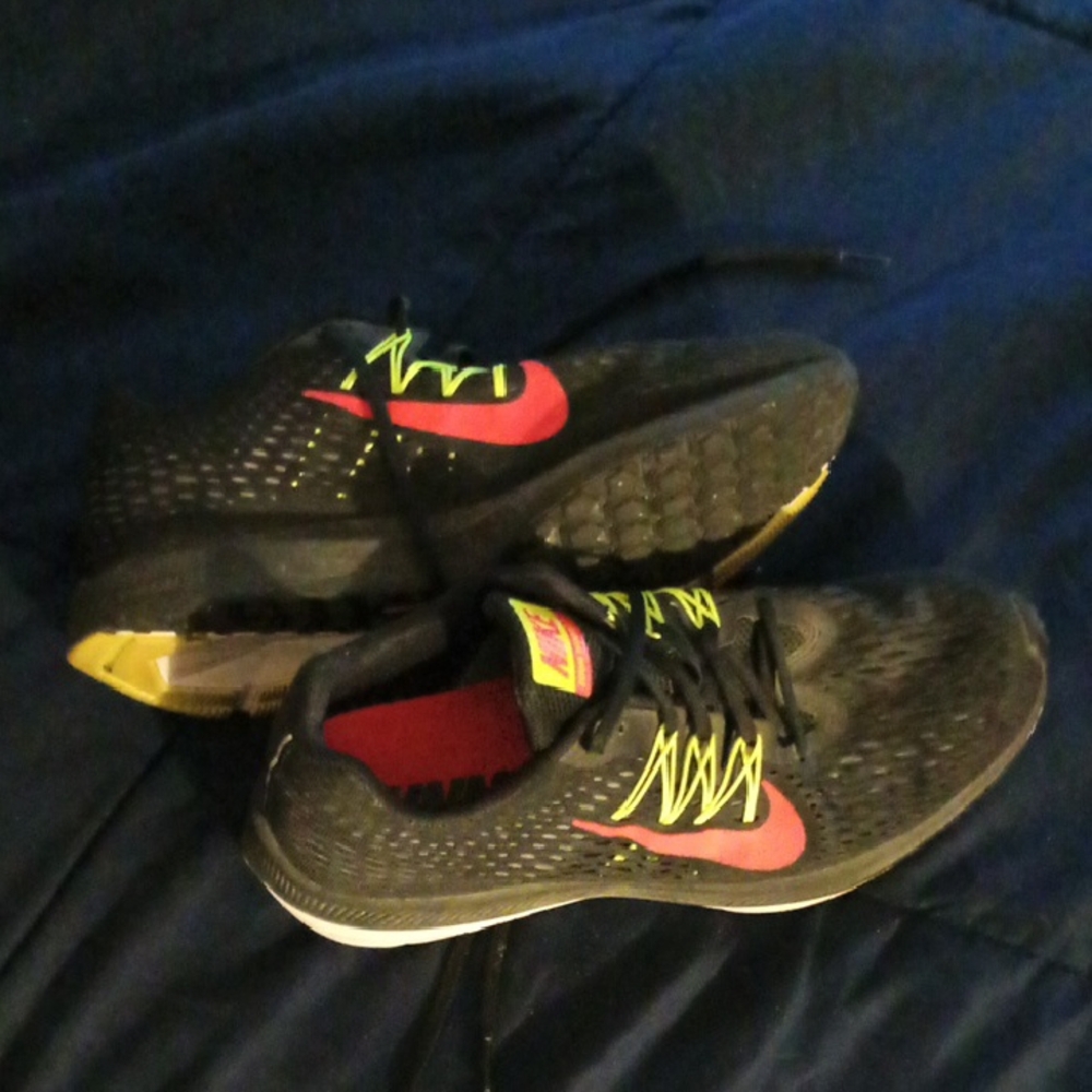 Nike Black Running Shoes with Red and Yellow Accents